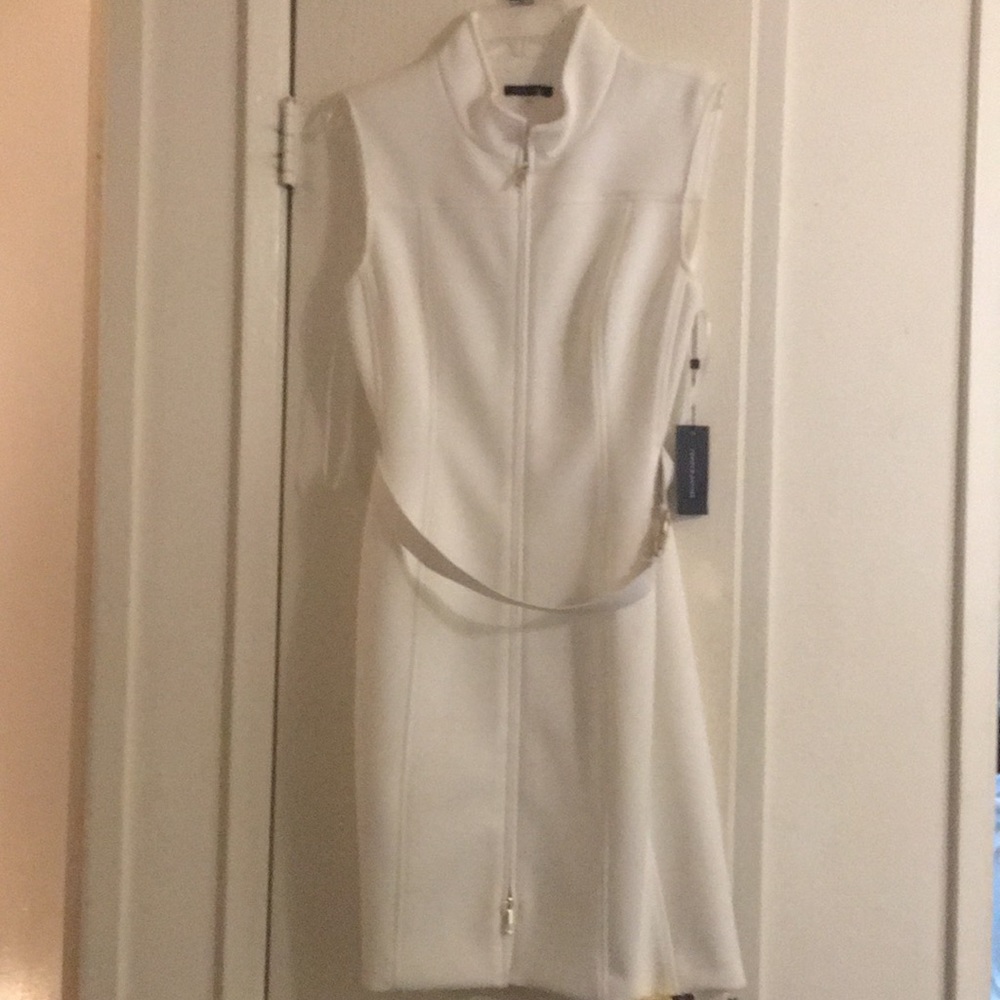 We are selling a white dress that includes a belt